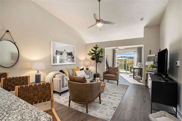 Delaware apartment for rent - A living room with a brown chair and a grey couch.