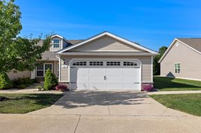 Delaware apartment for rent - A two-car garage is attached to a house.