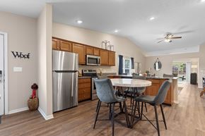 Lansing apartment for rent - A modern kitchen with a dining table and chairs.
