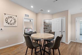 Lansing apartment for rent - A dining room with a round table and chairs.
