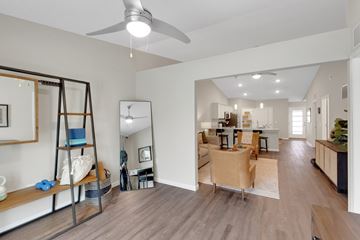 Fairborn apartment for rent - A living room with a brown sofa and a wooden floor.