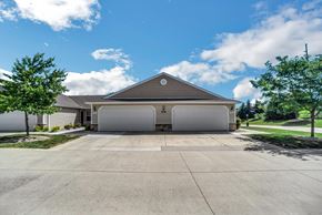Findlay apartment for rent - A two-car garage with a brown roof is situated in front of a house.