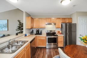 Findlay apartment for rent - A kitchen with wooden cabinets and stainless steel appliances.