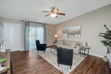 Findlay apartment for rent - A living room with a black chair and a white couch.