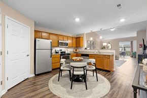 Fort Wayne apartment for rent - A kitchen with a table and chairs in the middle of the room.