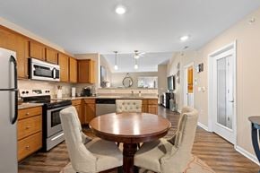 Fort Wayne apartment for rent - A kitchen with a table and chairs in the middle of the room.