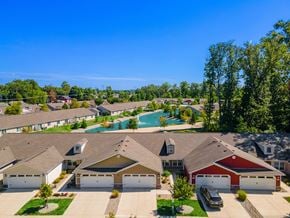 Fort Wayne apartment for rent - A suburban neighborhood with houses and a swimming pool.