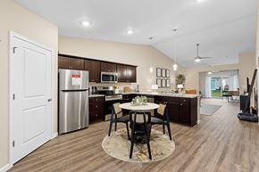 Fox River Grove apartment for rent - A kitchen with a dining table and chairs in the middle of the room.