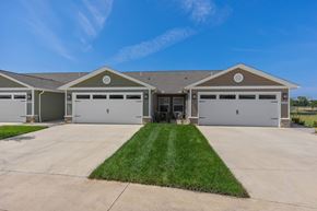 Galloway apartment for rent - A large house with a grey garage door.