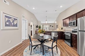 Galloway apartment for rent - A kitchen with a table and chairs in the middle of the room.