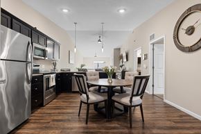 Grand Rapids apartment for rent - A modern kitchen with a dining table set for two.