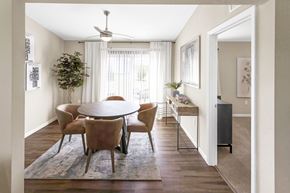 Greenwood apartment for rent - A dining room with a round table and chairs.