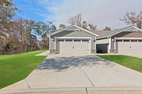 Greer apartment for rent - A two-car garage with a driveway in front.