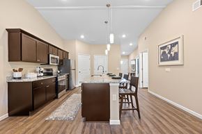 Greer apartment for rent - A kitchen with brown cabinets and a white island.