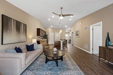 Greer apartment for rent - A living room with a white couch and a blue rug.