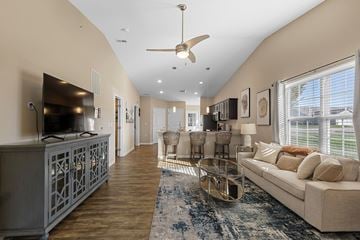 Grimes apartment for rent - A living room with a white couch and a television.
