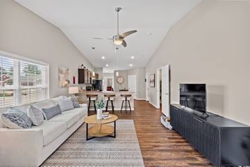 Grove City apartment for rent - A living room with a white couch and a wooden coffee table.