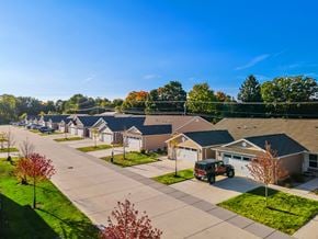Hartland apartment for rent - A suburban neighborhood with houses and trees.