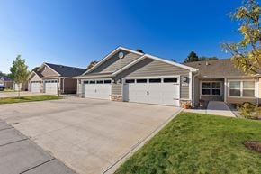 Hartland apartment for rent - A house with a grey roof and a grey garage door.