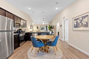 Hartland apartment for rent - A modern kitchen with a dining table and chairs.