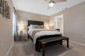 Hartland apartment for rent - A bedroom with a large bed and a ceiling fan.