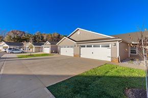 Hickory apartment for rent - A house with a garage and a driveway in front of it.