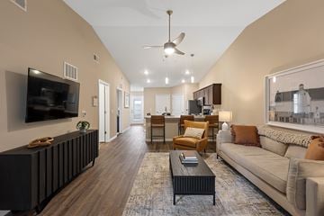 Hickory apartment for rent - A living room with a dark brown coffee table and a large couch.