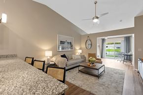 Holland apartment for rent - A bedroom with a large bed and a couch with a coffee table in between.