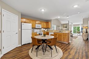 Johnstown apartment for rent - A kitchen with a table and chairs in the middle of the room.
