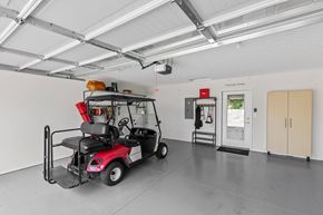 Johnstown apartment for rent - A red golf cart is parked inside a building.