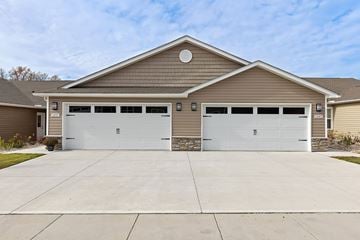 Kannapolis apartment for rent - A two-car garage is attached to a house.