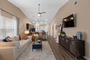 Kannapolis apartment for rent - A living room with a couch, coffee table, and a television.