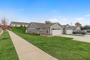 Kannapolis apartment for rent - A house with a grey roof and a white garage door.