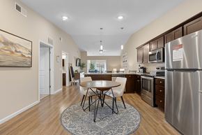 Kannapolis apartment for rent - A kitchen with a table and chairs in the middle of the room.