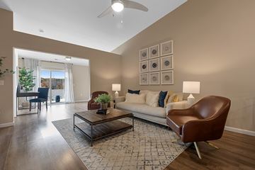 Kannapolis apartment for rent - A living room with a brown leather chair and a white couch.