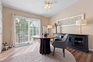 Lake Orion apartment for rent - A living room with a grey chair and a black table.