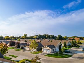 Lake Orion apartment for rent - A residential neighborhood with houses and trees.