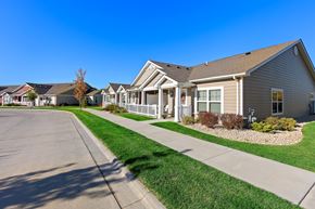 Lockport apartment for rent - A row of houses with a clear blue sky above them.