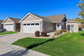 Lockport apartment for rent - A two-story house with a garage and a driveway.