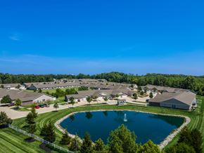 Marysville apartment for rent - A large pond in the middle of a grassy area surrounded by houses.