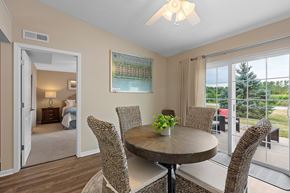 Maumee apartment for rent - A dining room with a round table and chairs.