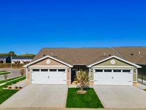 Merrillville apartment for rent - A house with two garages and a driveway.