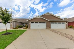 Miami Township apartment for rent - A house with a brown roof and two garages.
