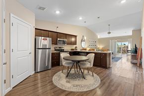 Monroe apartment for rent - A kitchen with a table and chairs in the middle of the room.