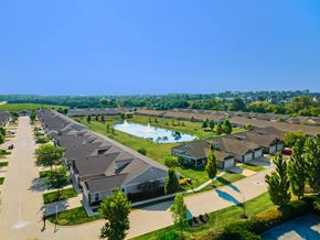 Noblesville apartment for rent - A residential area with houses and a swimming pool.