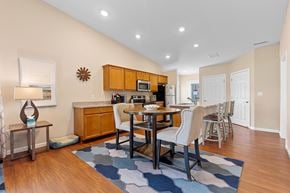 Noblesville apartment for rent - A modern kitchen with a dining table and chairs.