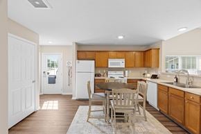 Pataskala apartment for rent - A kitchen with wooden cabinets and a white refrigerator.
