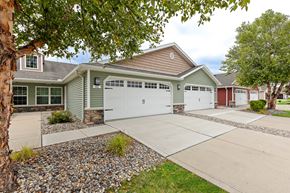 Perrysburg apartment for rent - A house with a green garage door.