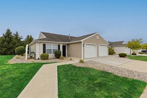 Perrysburg apartment for rent - A house with a grey roof and a white garage door.