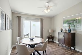 Plainfield apartment for rent - A dining room with a table, chairs, and a ceiling fan.